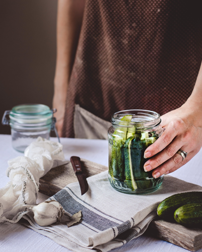 Person with Jar of Pickles